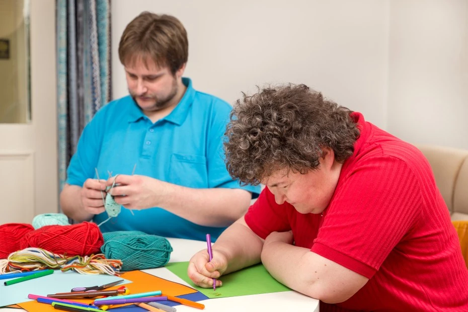 Two disabled friends in art class